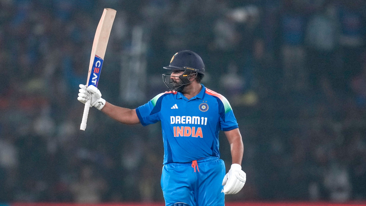 India captain Rohit Sharma raises his bat in celebration after completing his 32nd ODI hundred during the second ODI against England in Cuttack. AP India captain Rohit Sharma raises his bat in celebration after completing his 32nd ODI hundred during the second ODI against England in Cuttack. AP