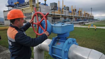 (File) In this October 7, 2015 photo, a worker at a Ukrainian gas station Volovets in western Ukraine controls a valve. AP