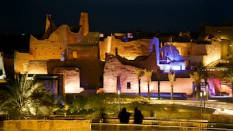 Visitors watch ancient palaces of the 18th Century Diriyah fortified complex, that once served as the seat of power for the ruling Al Saud, in Riyadh, Saudi Arabia. AP