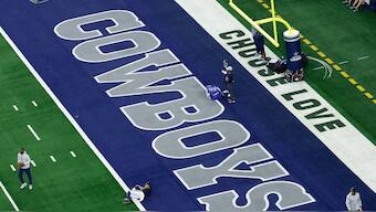 The word's 'Choose Love' are displayed in the end zone before a NFL football game between the Washington Commanders and the Dallas Cowboys in January 2025. Image: AP