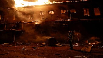 A firefighter works at a site of an apartment building damaged during a Russian drone strike, amid Russia's attack on Ukraine, in Kharkiv, Ukraine, on January 28, 2025. Reuters File