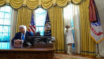 White House press secretary Karoline Leavitt closes a curtain before US President Donald Trump signs documents in the Oval Office at the White House in Washington, US, on  February 4, 2025. Reuters File