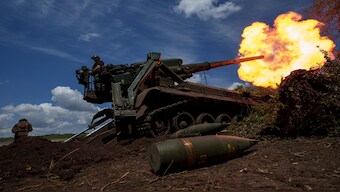 Ukrainian soldiers of 43rd artillery brigade fire by 2s7 self-propelled howitzer towards Russian positions at the frontline in Donetsk region, Ukraine, on Monday. AP File