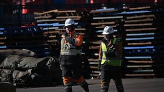 Workers are seen in a port at Binhai economic area in the municipality of Tianjin, northwest China on February 5, 2025. AFP/Representational image