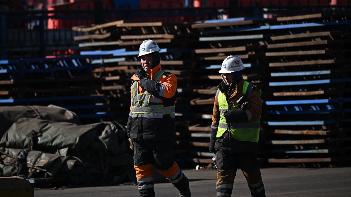 Workers are seen in a port at Binhai economic area in the municipality of Tianjin, northwest China on February 5, 2025. AFP/Representational image Workers are seen in a port at Binhai economic area in the municipality of Tianjin, northwest China on February 5, 2025. AFP/Representational image