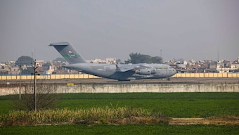 A US military aircraft carrying illegal Indian immigrants upon its landing at the Shri Guru Ramdas Ji International Airport, in Amritsar, February 5, 2025. PTI