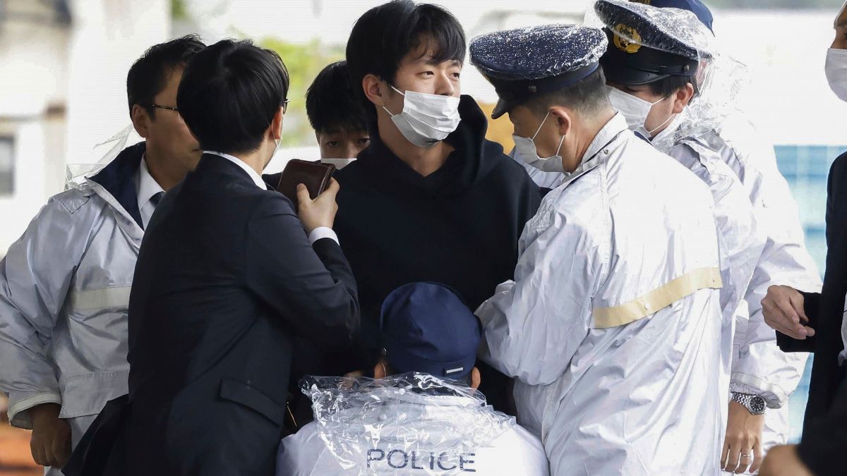 Ryuji Kimura, center, is caught by police after he threw a homemade pipe bomb at Japan's former Prime Minister Fumio Kishida during a campaign event at a fishing port in Wakayama, western Japan, on April 15, 2023. AP Ryuji Kimura, center, is caught by police after he threw a homemade pipe bomb at Japan's former Prime Minister Fumio Kishida during a campaign event at a fishing port in Wakayama, western Japan, on April 15, 2023. AP