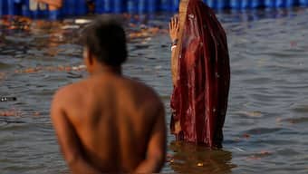 A devotee takes a holy dip at Sangam during the Maha Kumbh Mela in Prayagraj, January 28, 2025. Reuters