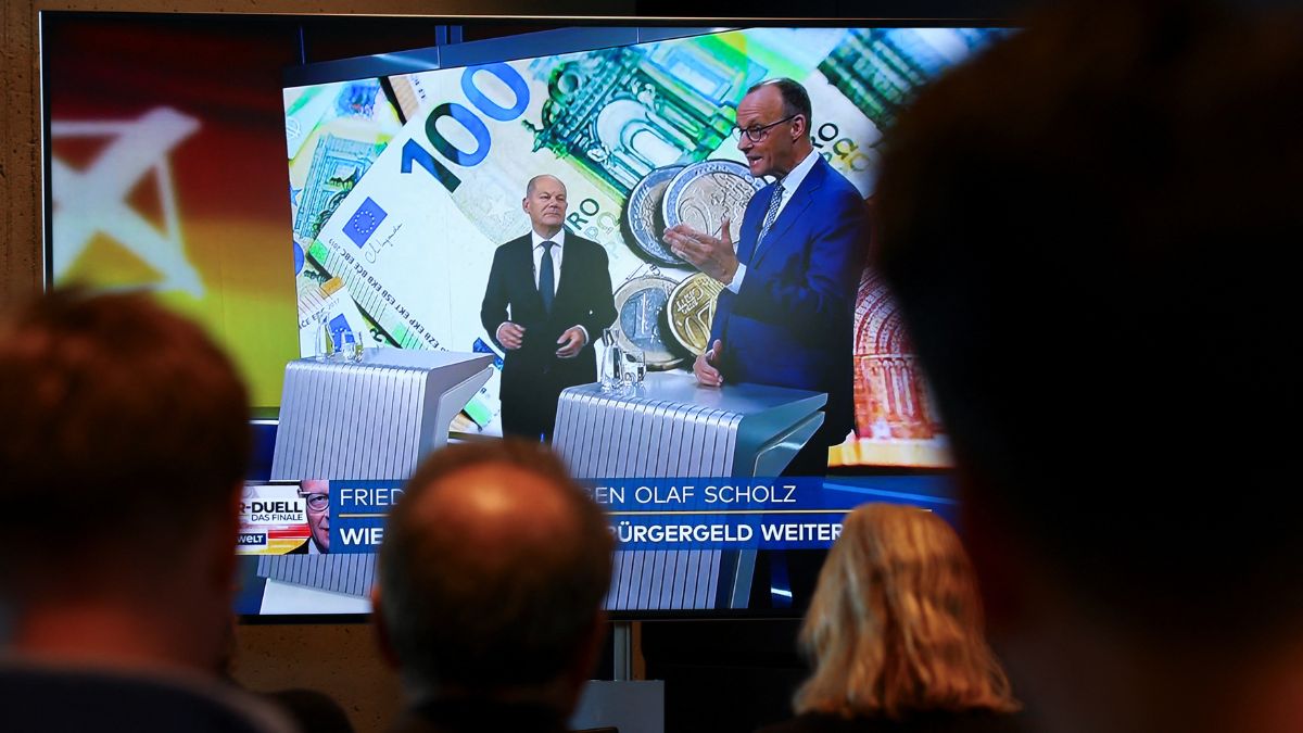 Members of the media watch German Chancellor of the Social Democratic Party (SPD), Olaf Scholz and his conservative rival of the Christian Democratic Union (CDU) Friedrich Merz debate on Welt TV, on a television screen, in Berlin, Germany, February 19, 2025. Reuters Members of the media watch German Chancellor of the Social Democratic Party (SPD), Olaf Scholz and his conservative rival of the Christian Democratic Union (CDU) Friedrich Merz debate on Welt TV, on a television screen, in Berlin, Germany, February 19, 2025. Reuters