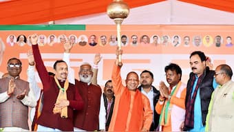 Uttar Pradesh Chief Minister Yogi Adityanath along with BJP candidate Chandrabhan Paswan in Ayodhya. X/@myogiadityanath
