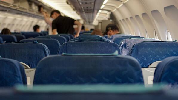 Why was Australian couple forced to sit next to dead body on flight?