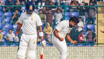Himanshu Sangwan (right) celebrates after dismissing Virat Kohli during the Ranji Trophy match between Delhi and Railways. PTI