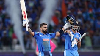 Virat Kohli celebrates after scoring a boundary to bring up his 51st ton. Image: Reuters