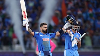Virat Kohli celebrates after scoring a boundary to bring up his 51st ton. Image: Reuters