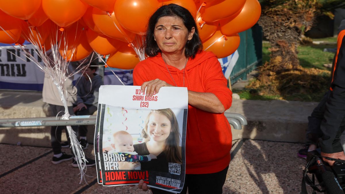 A supporter holds a portrait of of Shiri and Kfir Bibas, the youngest hostage to be kidnapped by Hamas on the October 7 attack together with his mother and brother. File image/AFP A supporter holds a portrait of of Shiri and Kfir Bibas, the youngest hostage to be kidnapped by Hamas on the October 7 attack together with his mother and brother. File image/AFP