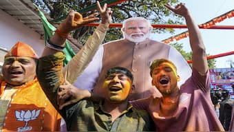 BJP supporters celebrate the party's decisive lead in the Delhi Assembly polls at the Delhi BJP office in New Delhi. With this win, the BJP will make a comeback to the capital after 27 years. PTI