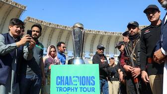 People with their mobile phones take photos of the ICC Champions trophy, during a ceremony at the Arbab Niaz Cricket Stadium in Peshawar, Pakistan, on February 6. The tournament, hosted by Pakistan and the UAE, starts today. Reuters 