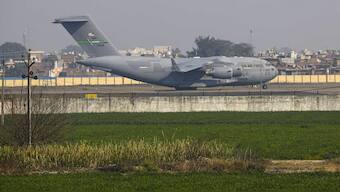 A US military aircraft carrying illegal Indian immigrants upon its landing at the Shri Guru Ramdas Ji International Airport, in Amritsar. PTI