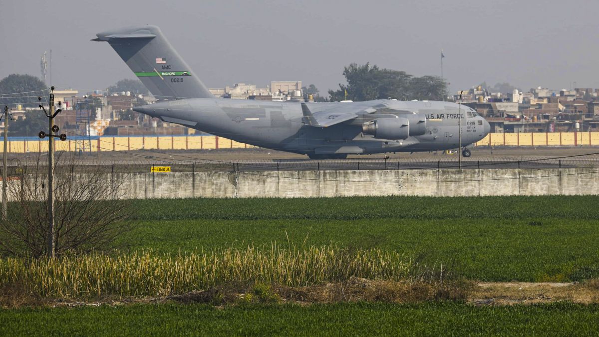 A US military aircraft carrying illegal Indian immigrants upon its landing at the Shri Guru Ramdas Ji International Airport, in Amritsar. PTI A US military aircraft carrying illegal Indian immigrants upon its landing at the Shri Guru Ramdas Ji International Airport, in Amritsar. PTI
