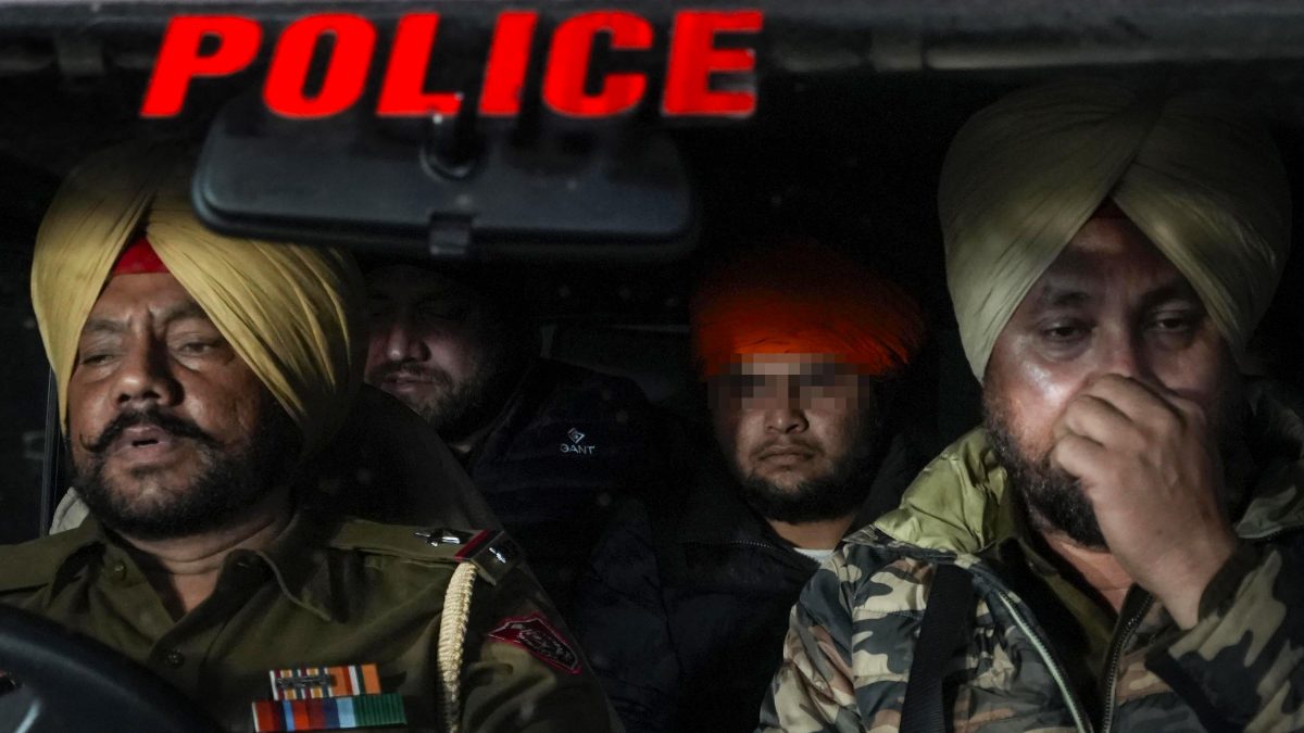 Indians deported from the US being escorted by the police as they leave the airport upon their arrival, in Amritsar. PTI Indians deported from the US being escorted by the police as they leave the airport upon their arrival, in Amritsar. PTI