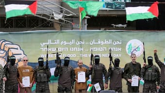 Or Levy, Eli Sharabi and Ohad Ben Ami, hostages held in Gaza since the deadly October 7, 2023 attack, are released by Hamas militants as part of a ceasefire and a hostages-prisoners swap deal between Hamas and Israel in Deir Al-Balah in the central Gaza Strip. Reuters