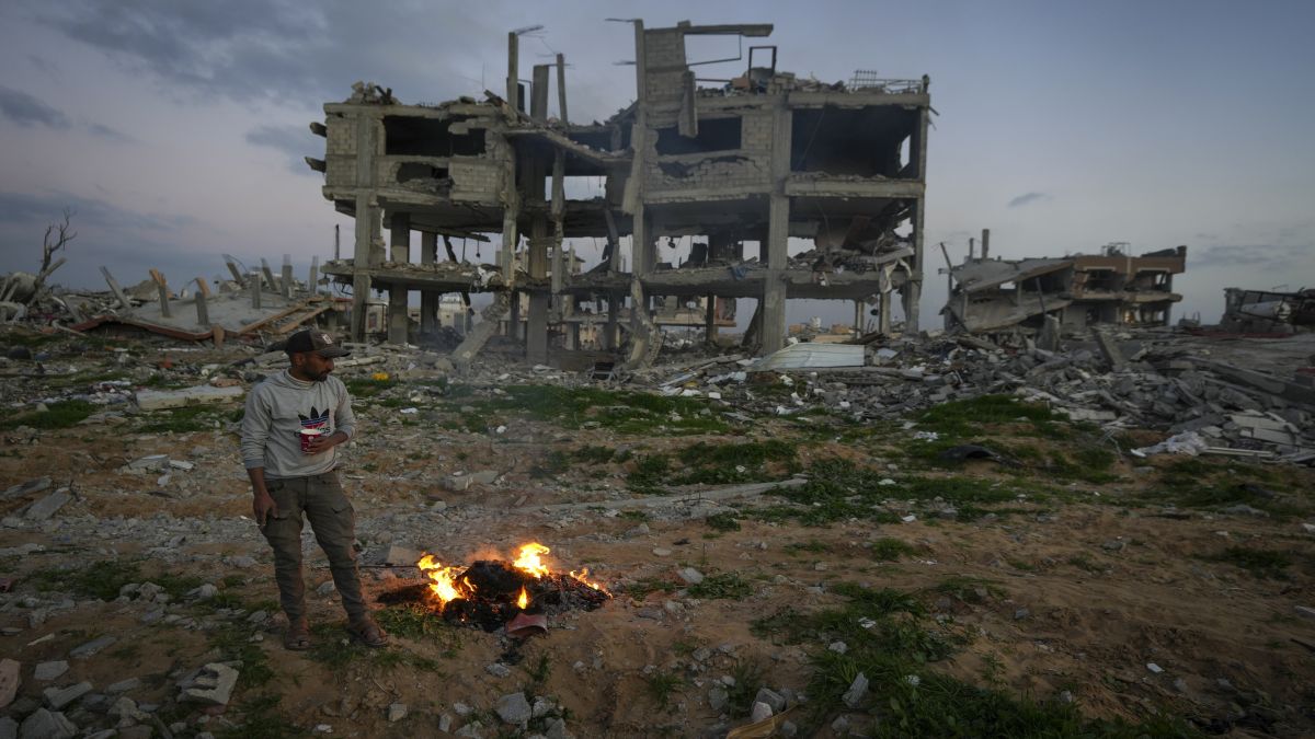 A man stands by a fire next to a destroyed house in an area littered with rubble from buildings demolished during the Israeli army's ground and air offensive against Hamas in Gaza City. US President Donald Trump, on Tuesday, announced that there was a plan for the US to "take over Gaza" and transform it into the "Riviera of the Middle East". AP A man stands by a fire next to a destroyed house in an area littered with rubble from buildings demolished during the Israeli army's ground and air offensive against Hamas in Gaza City. US President Donald Trump, on Tuesday, announced that there was a plan for the US to "take over Gaza" and transform it into the "Riviera of the Middle East". AP