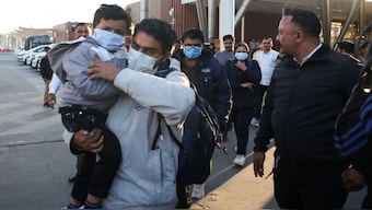 Indian immigrants deported from the US, walk out of the airport in Ahmedabad, India on February 6. Hundred and four deportees were sent back on a military aircraft. Reuters 