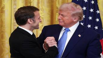 US President Donald Trump and French President Emmanuel Macron look at each other on the day of a press conference, at the White House in Washington, DC. Reuters