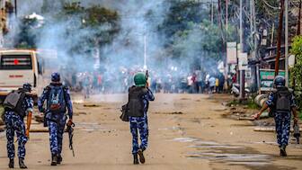 Security personnel fire tear gas shells against protesters in Imphal. The violence in the state has claimed the lives of over 200 people. File image/PTI