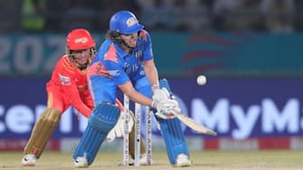 Nat Sciver-Brunt of Mumbai Indians plays a scoop shot against Gujarat Giants. Image: WPL