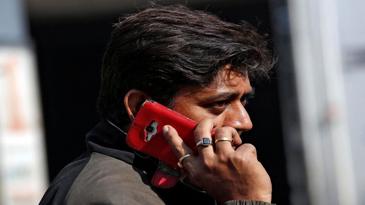 A man talks on his mobile phone while walking on a road in Kolkata. Representational image/Reuters A man talks on his mobile phone while walking on a road in Kolkata. Representational image/Reuters