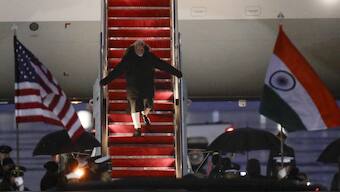 Prime Minister Narendra Modi walks down the stairs from his plane upon his arrival at Joint Base Andrews, on February 12. PM will meet Donald Trump and hold several other bilaterals. AP