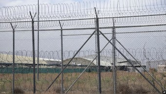  A hangar can be seen behind barbed wire fencing at Bagram Air Base after the U.S. military left the facility, in Parwan province, north of Kabul, Afghanistan, July 5, 2021. File Image: AP