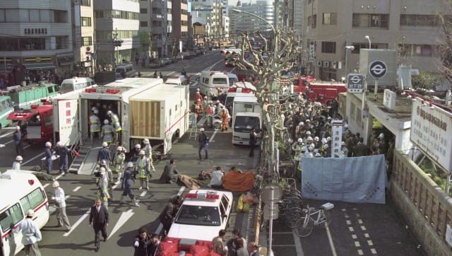 The injured of the deadly gas attack are treated by rescue workers near Tsukiji subway station in Tokyo, in this photo taken by Kyodo March 20, 1995. Kyodo via Reuters