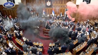 Serbian opposition lawmakers let off smoke grenades inside Serbian parliament, in Belgrade, Serbia March 4, 2025, in this screengrab taken from a video. Serbia Parliament Pool/Reuters