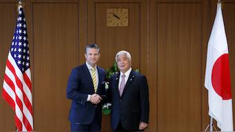 Pete Hegseth, US secretary of defense, and Gen Nakatani, Japan's defense minister, shake hands while posing for photographs prior to their meeting at the Ministry of Defense in Tokyo, Japan. Reuters