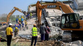 Rescue workers continue a search operation at the site of a collapsed building, in the aftermath of a strong earthquake, in Mandalay, Myanmar. Reuters