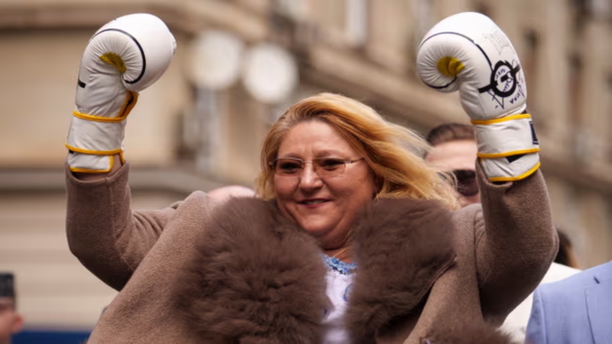 Diana Șoșoacă donned boxing gloves as she filed her candidacy on Thursday, declaring herself ready to ‘fight the system once again’. AP Diana Șoșoacă donned boxing gloves as she filed her candidacy on Thursday, declaring herself ready to ‘fight the system once again’. AP