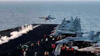 This grab from footage shared by the US Central Command (CENTCOM) on March 15, 2025 shows a US F/A-18 fighter aircraft taking off from an aircraft carrier at sea reportedly amidst operations launched against Houthis in Yemen. AFP