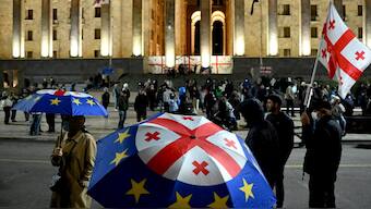 Georgian anti-government protesters rally outside the parliament in Tbilisi. AFP