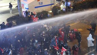Protesters clash with Turkish anti riot police as they use tear gas and water cannons during a demonstration following the arrest of Istanbul's mayor, in Ankara. AFP