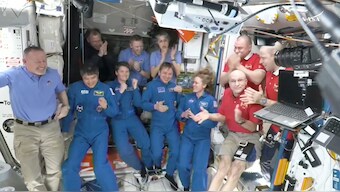 This image made from video by NASA shows astronauts greeting each other after a SpaceX capsule docked with the International Space Station, Sunday, March 16, 2025. Top row from left: Nick Hague, Alexander Gorbunov, Suni Williams, Alexei Ovchinin and Ivan Vagner. Bottom row from left: Butch Wilmore, Takuya Onishi, Anne McClain, Kirill Peskov, Nichole Ayers and Don Pettit. AP