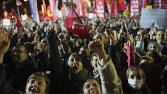 Protesters shout slogans during a protest after Istanbul's Mayor Ekrem Imamoglu was arrested and sent to prison, in Istanbul, Turkey. AP