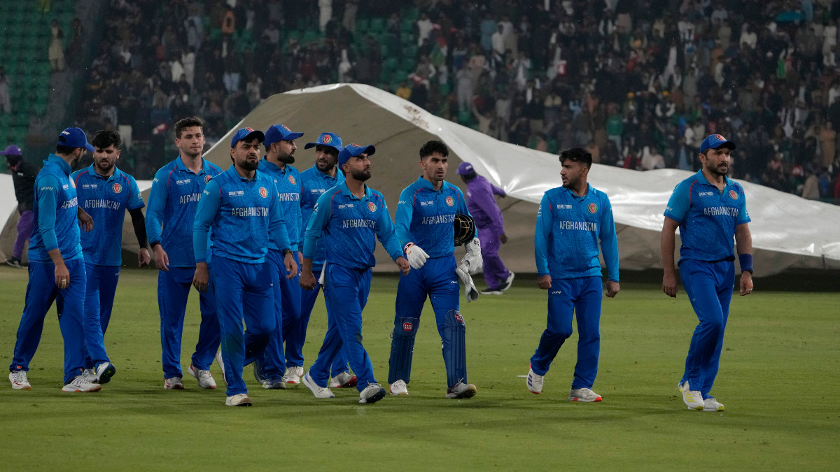 Afghanistan players walk off the field after heavy rain stops play during their Champions Trophy Group B match against Australia in Lahore. AP Afghanistan players walk off the field after heavy rain stops play during their Champions Trophy Group B match against Australia in Lahore. AP