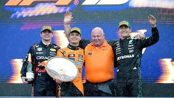 McLaren's Lando Norris celebrates with the trophy on the podium after winning the Australian Grand Prix. Image: Reuters