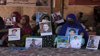 Baloch activists hold pictures of their missing family members in Islamabad, Pakistan, 2023. Representational image: AP