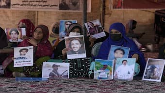 Baloch activists hold pictures of their missing family members in Islamabad, Pakistan, 2023. Representational image: AP