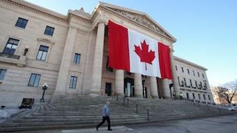 A large Canadian flag hangs on the front of the Manitoba Legislative Building in Winnipeg, Manitoba, Canada, March 5, 2025. (Photo: Reuters)