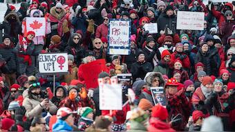 Protestors take part in a "Mothers out Front" demonstration against US President Donald Trump and Elon Musk near the United States embassy in Ottawa, Saturday, March 8, 2025. The Canadian Press via AP