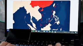 Illustration showing the nine-dash line on a map of a disputed area of the South China Sea on a laptop in Lao Cai province. File Image/AFP